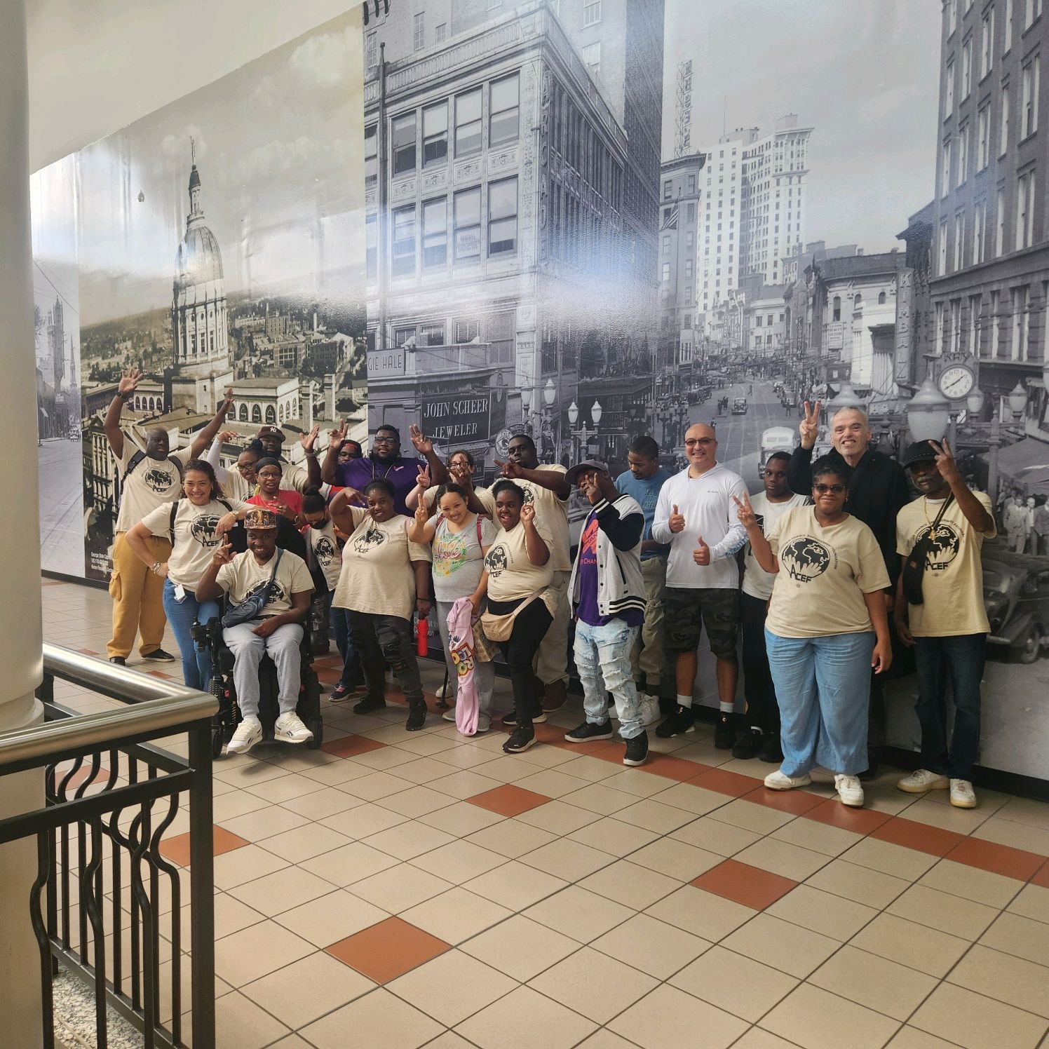 ACEF community members gathered at the Georgia State Capitol on a group outing, smiling and waving